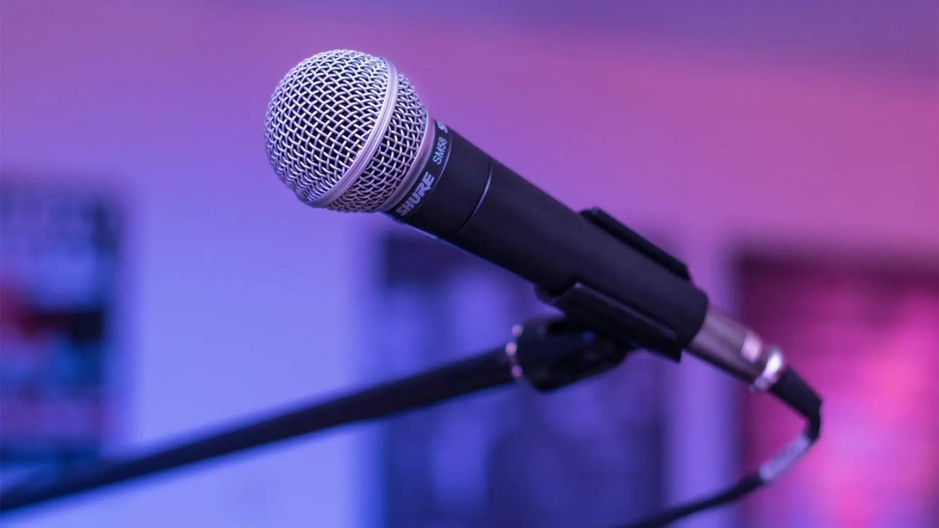A microphone on a stage of a live music venue