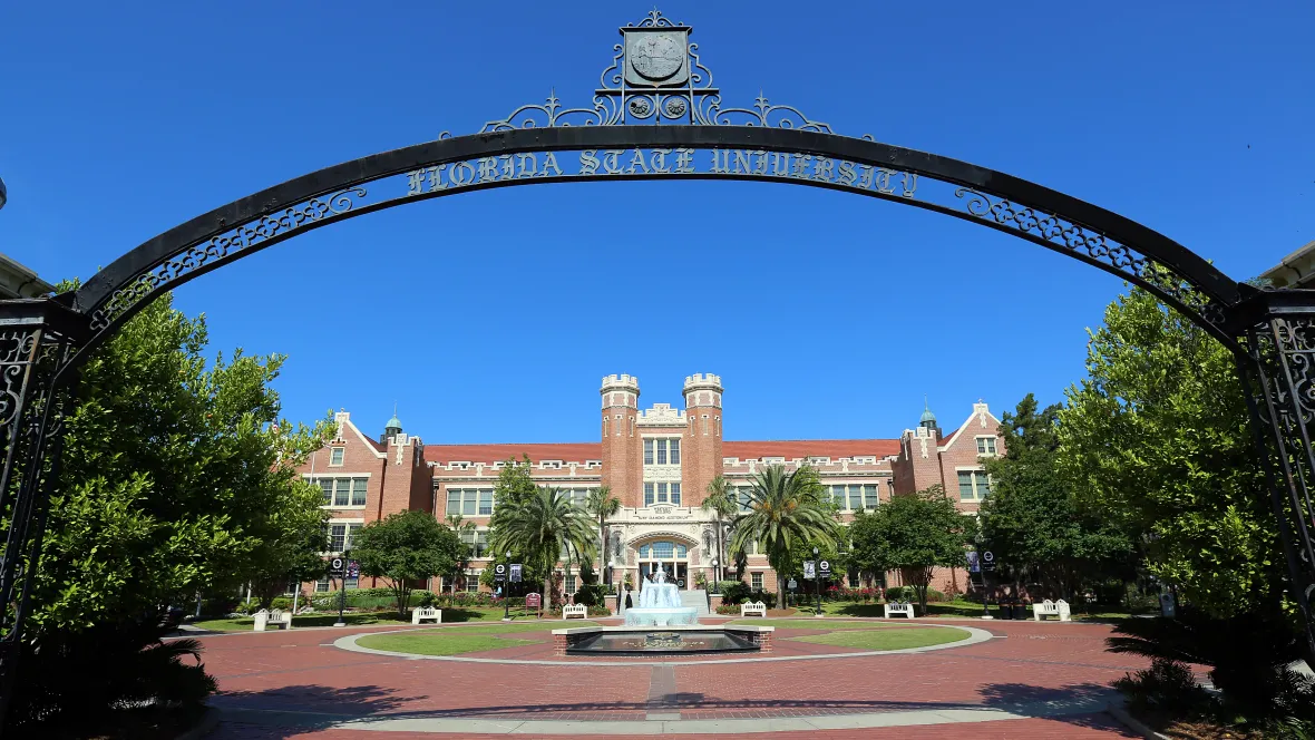 View of FSU campus through the historic entry arch to the iconic Wescott Square.