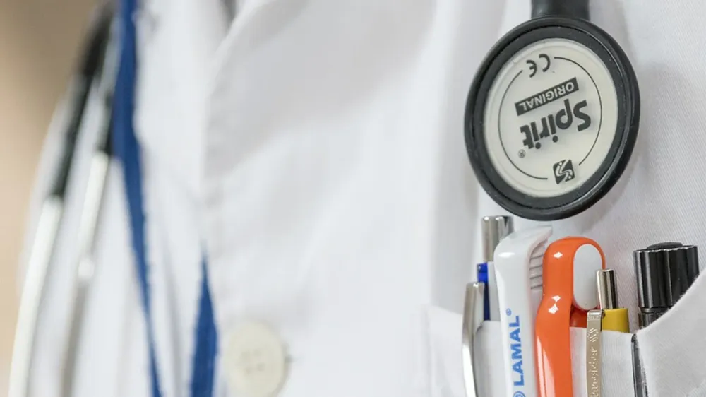 A close-up of a doctor's coat and stethoscope 