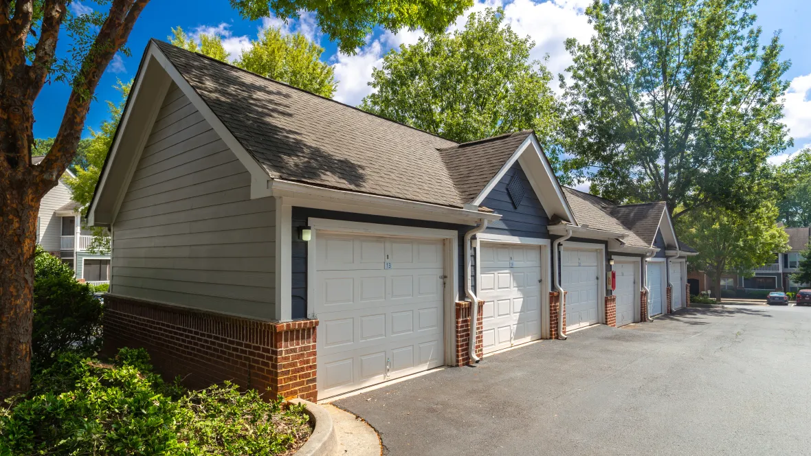 Detached garages available for rent, neatly lined across the parking lot, ensuring secure and convenient parking options within The Everlee community.