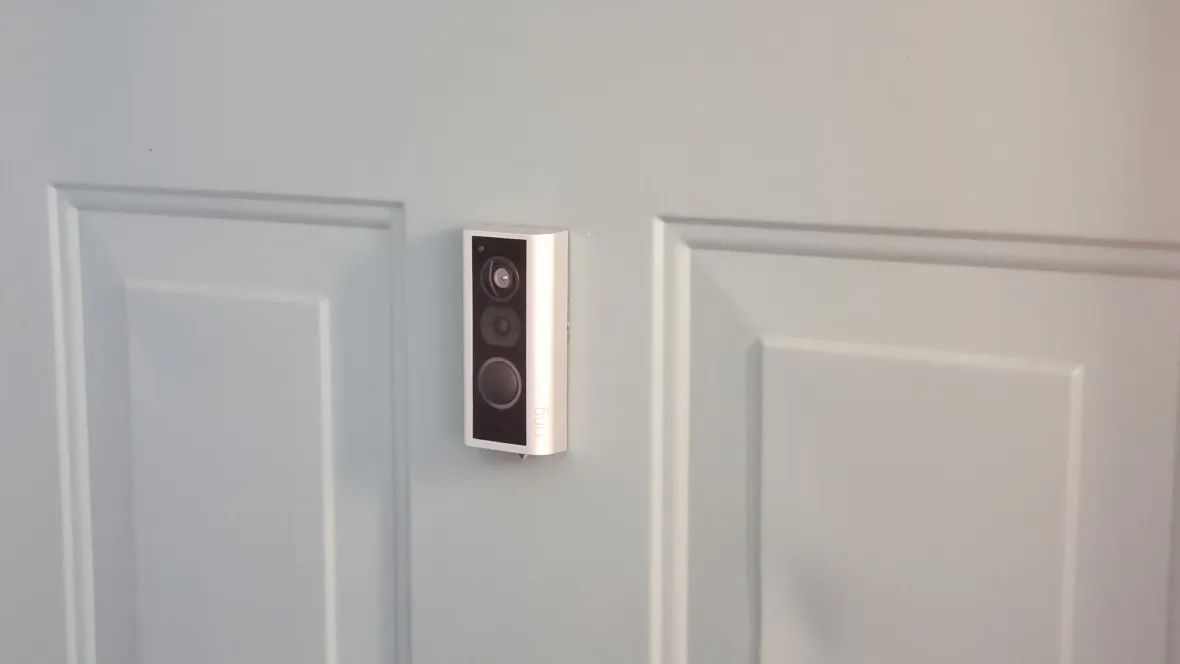 A Ring doorbell system installed on the front of an apartment door, offering residents convenient monitoring of their home.