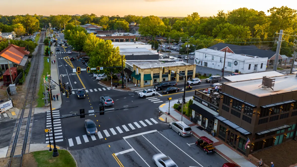 A lively street scene revealing The Everlee's close-knit connection to downtown Woodstock, vibrant with shops, culture, and the pulse of city life.