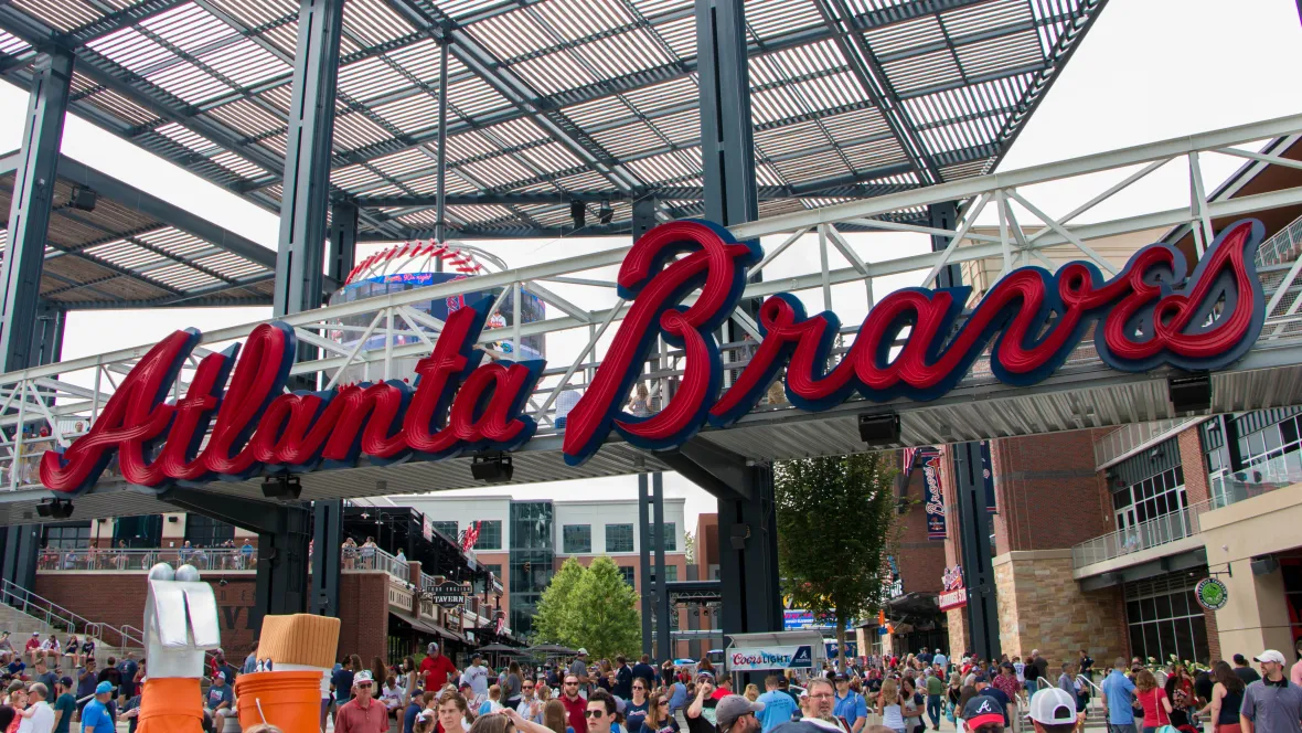 The sign at the entrance of Truist Park baseball Stadium that reads: "Atlanta Braves", located close to 12th & James Apartments.