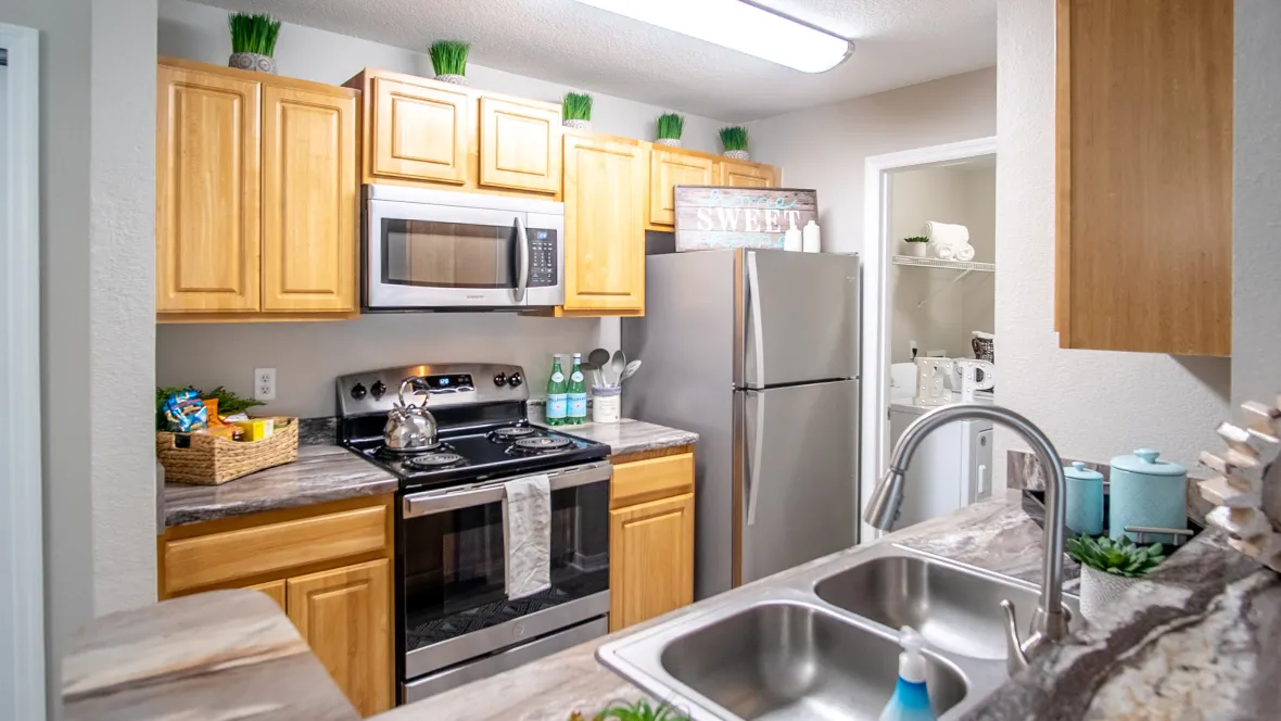 A brightly lit kitchen at Eagle's Pointe, boasting modern upgrades that make it not only look good but also feel great to cook in.
