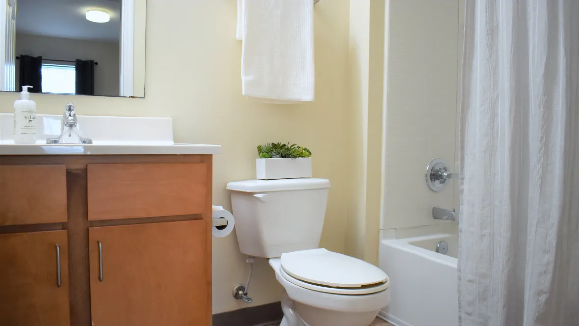 A bathroom with a garden tub and ample cabinet storage