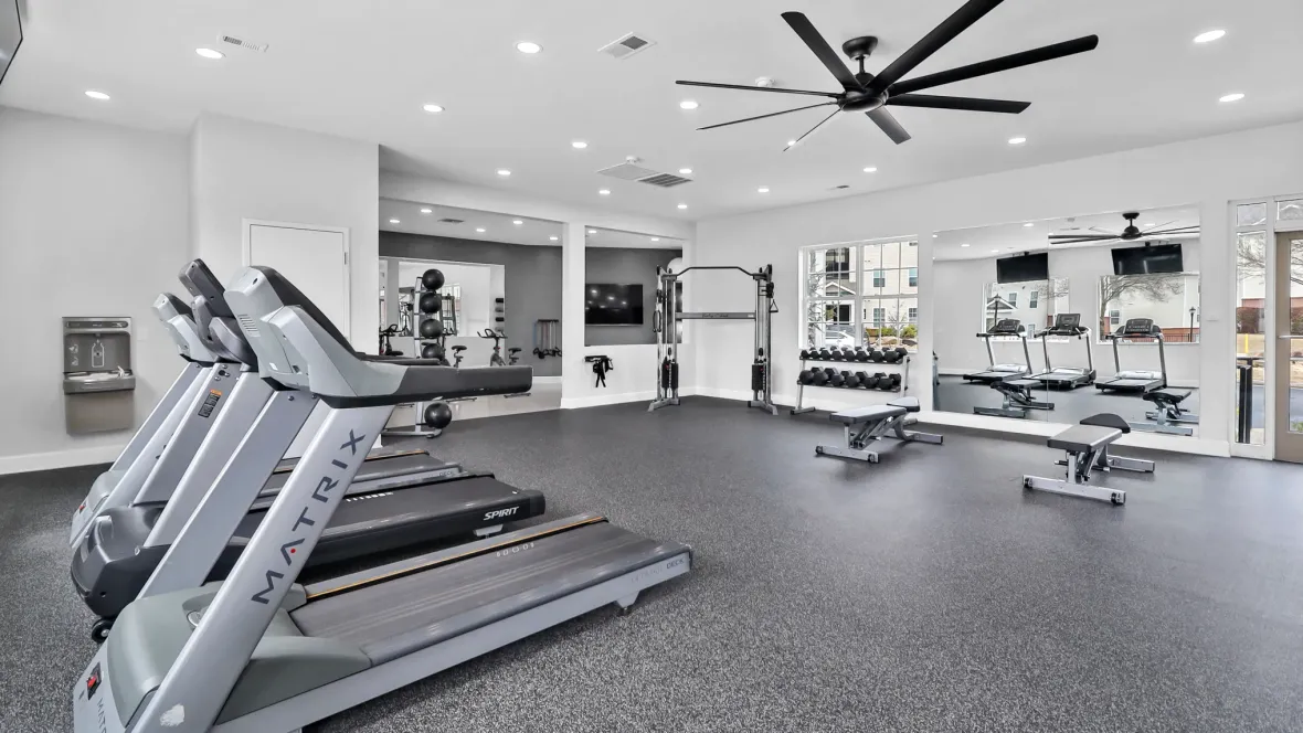 A humongous, well-lit fitness center with a huge variety of cardio and strength equipment