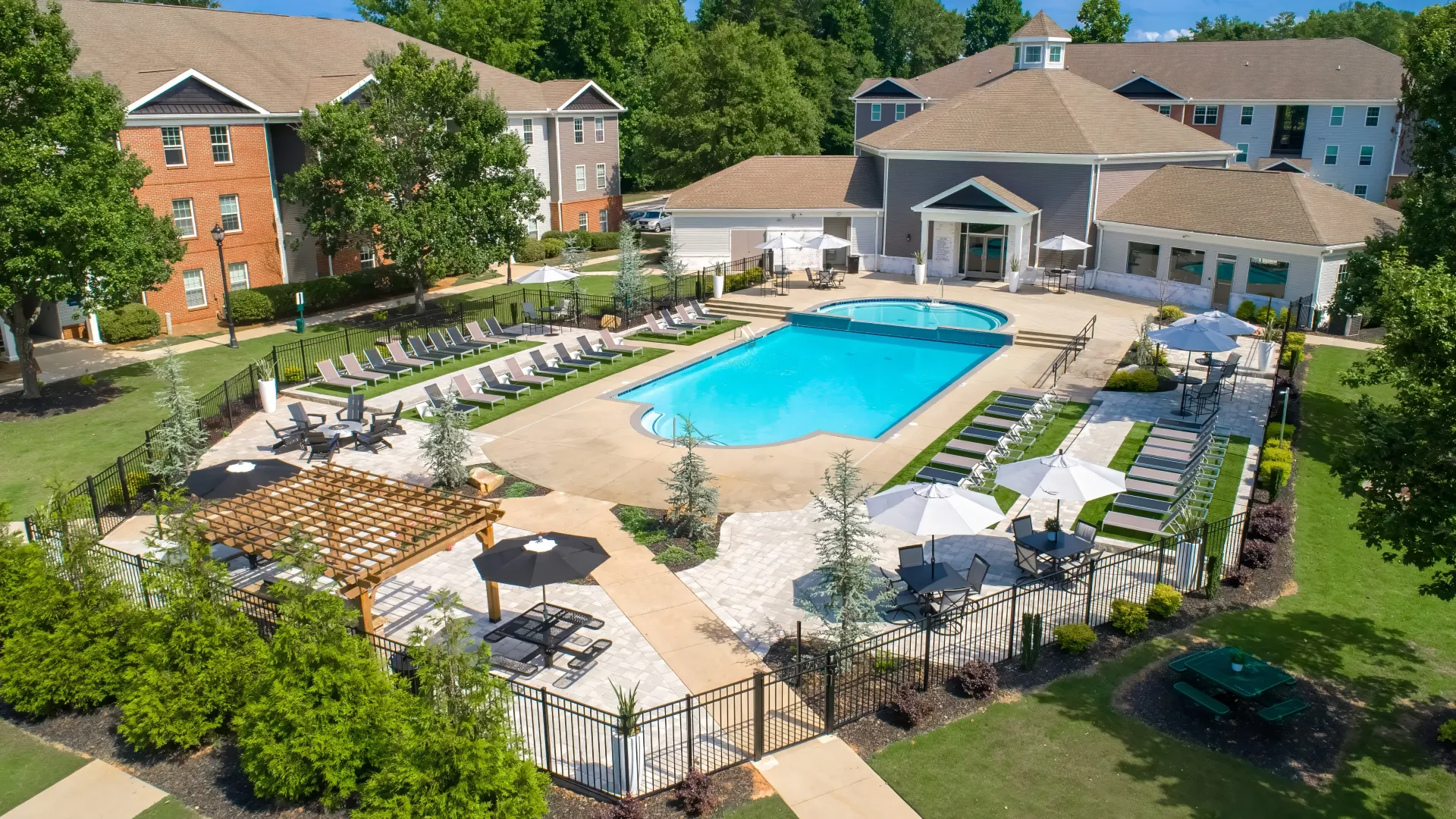 A bird’s eye view of the sprawling gated pool deck complete with elegant pavers 