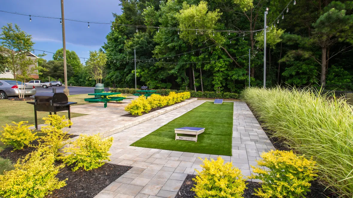 A premiere look at captivating landscaping defining the cornhole court