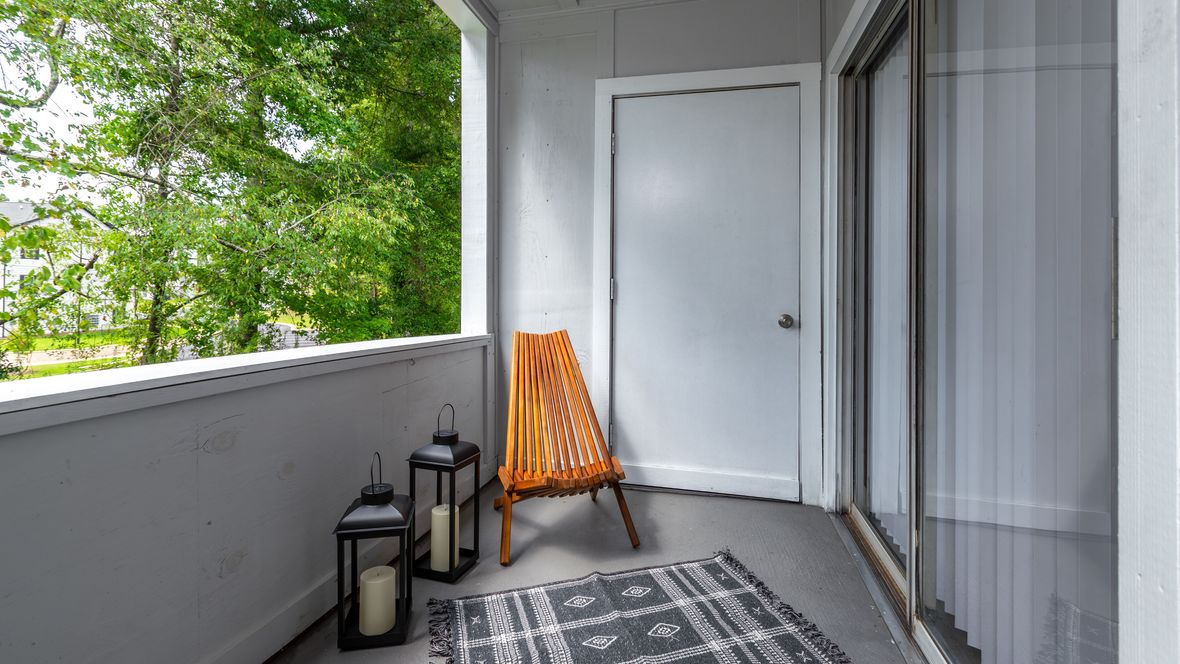 An expansive balcony with unobstructed views, featuring a bonus storage closet