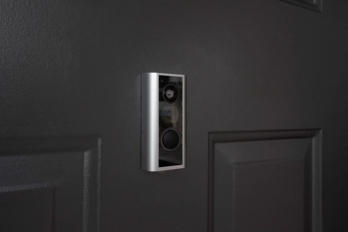 A smart video Ring doorbell installed at the apartment's front entry door, offering real-time convenience and security features for residents.