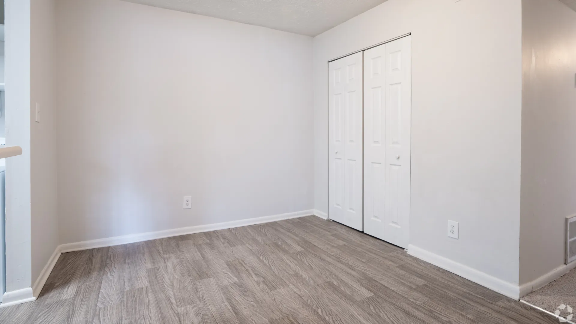 Dining room area with modern flooring and closet in The Whitlock floor plan.