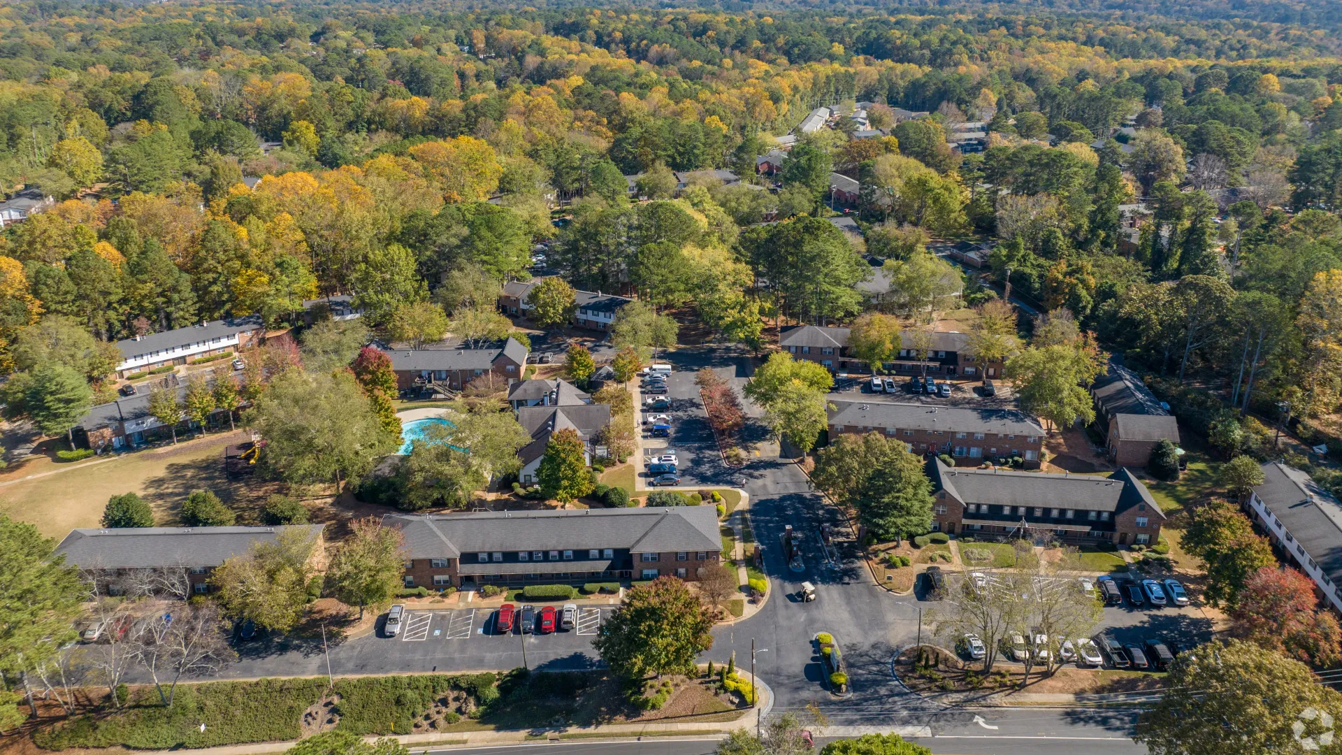 Aerial view of the Legacy at West Cobb apartment community, surrounded by trees and greenery in Marietta, GA.