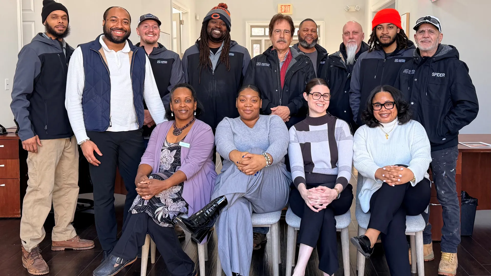 Legacy at West Cobb team members smiling together inside the leasing office.
