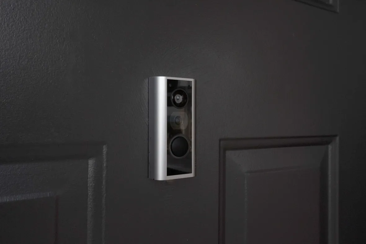 Ring doorbell on an apartment's front door.