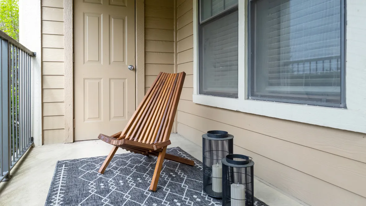 A private patio with seating and ample outdoor storage space, ready for students to enjoy outdoor living.