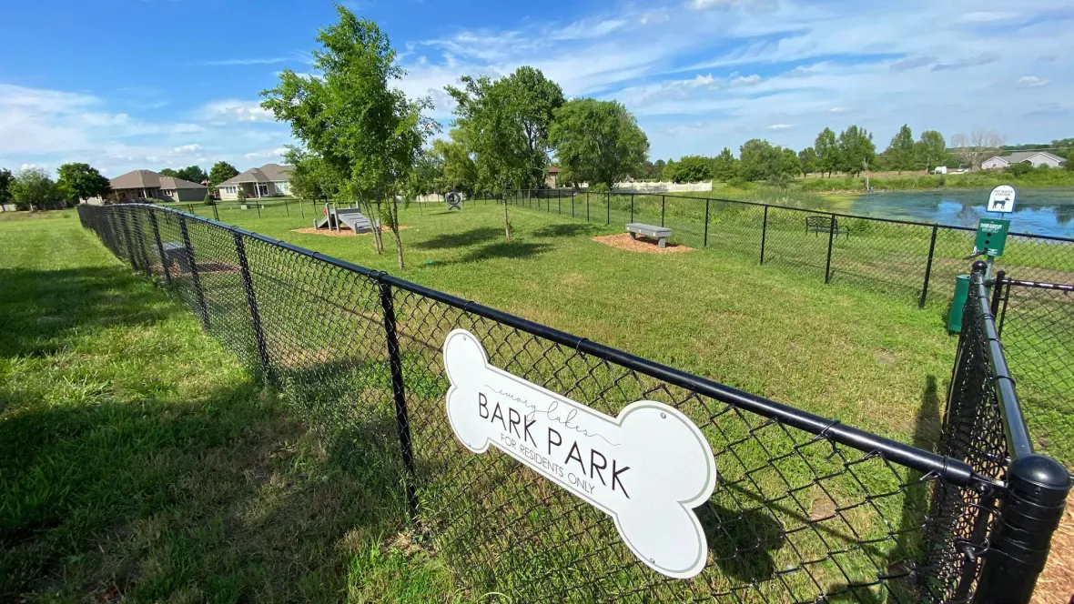 A welcoming dog park with agility equipment