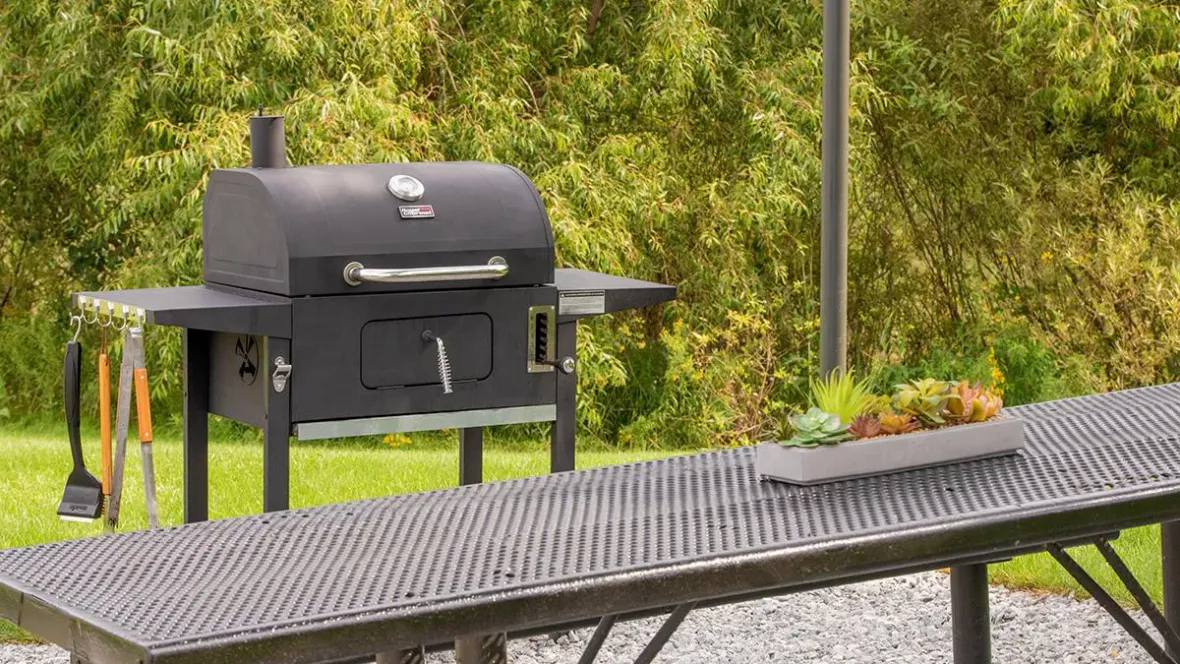 A close-up of our picnic area with a charcoal grill, the perfect spot for outdoor gatherings.