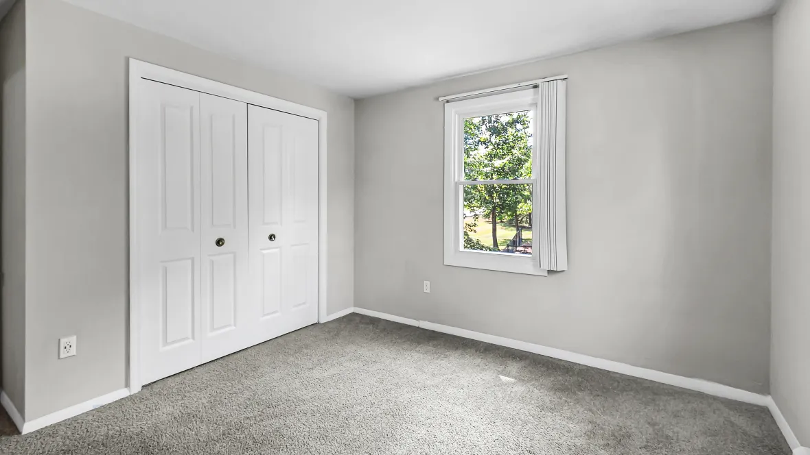 Large bedroom closets with double doors.