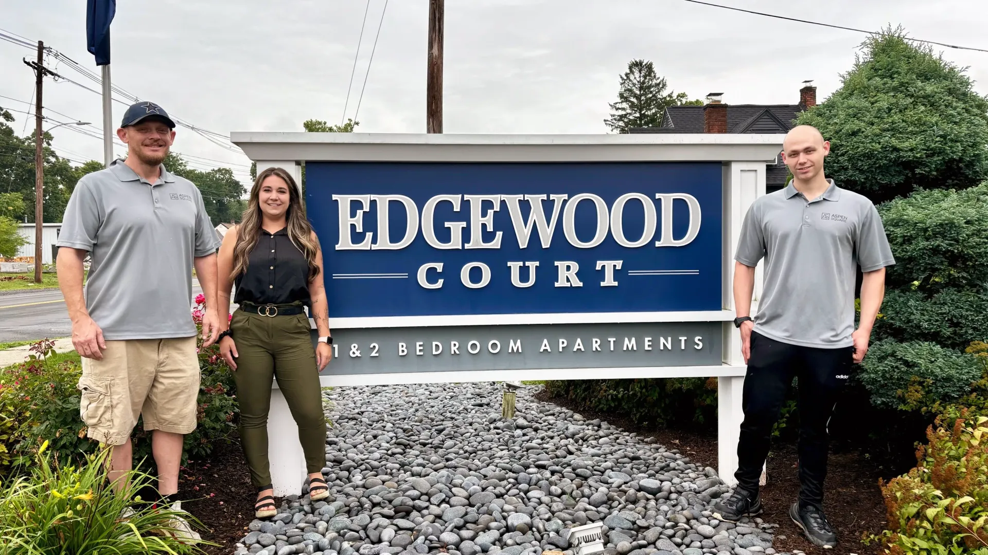 A group photo of the leasing and maintenance team members at Edgewood Court Apartments