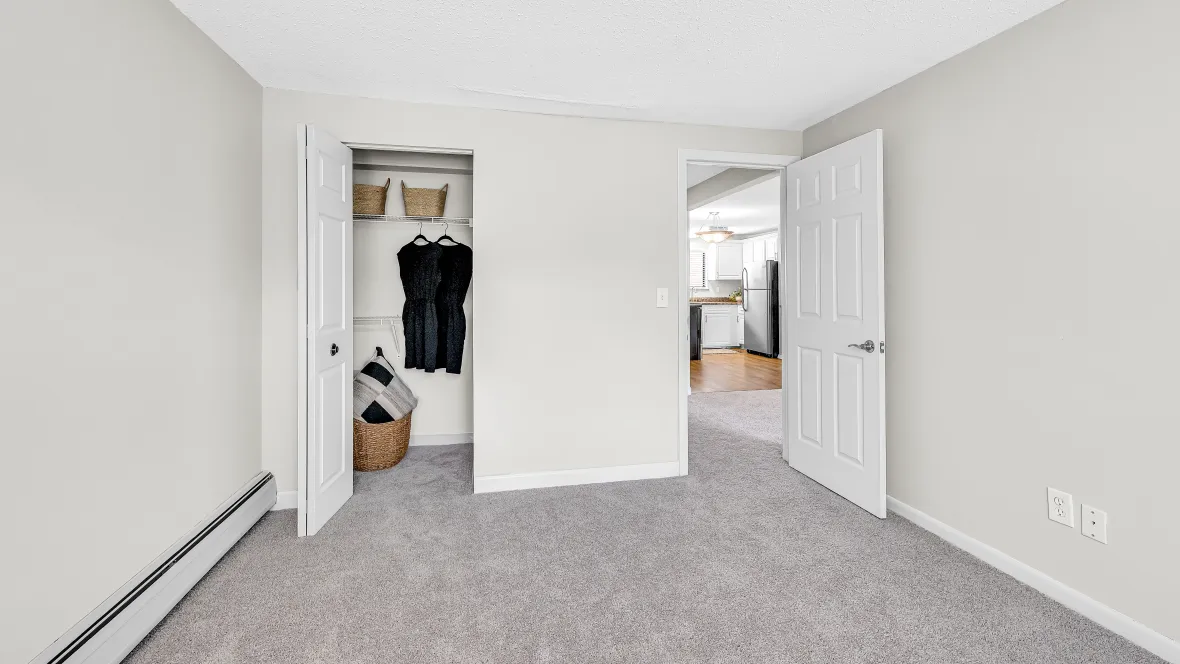 A bedroom closet featuring built-in shelving providing unmatched organization and storage simplicity.