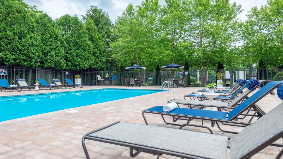  An inviting sparkling swimming pool and sundeck where residents relax and soak up the sunshine.