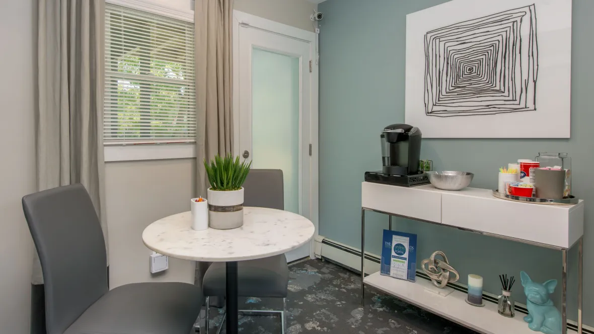 Inside the leasing office, an inviting coffee station with a charming table setup.