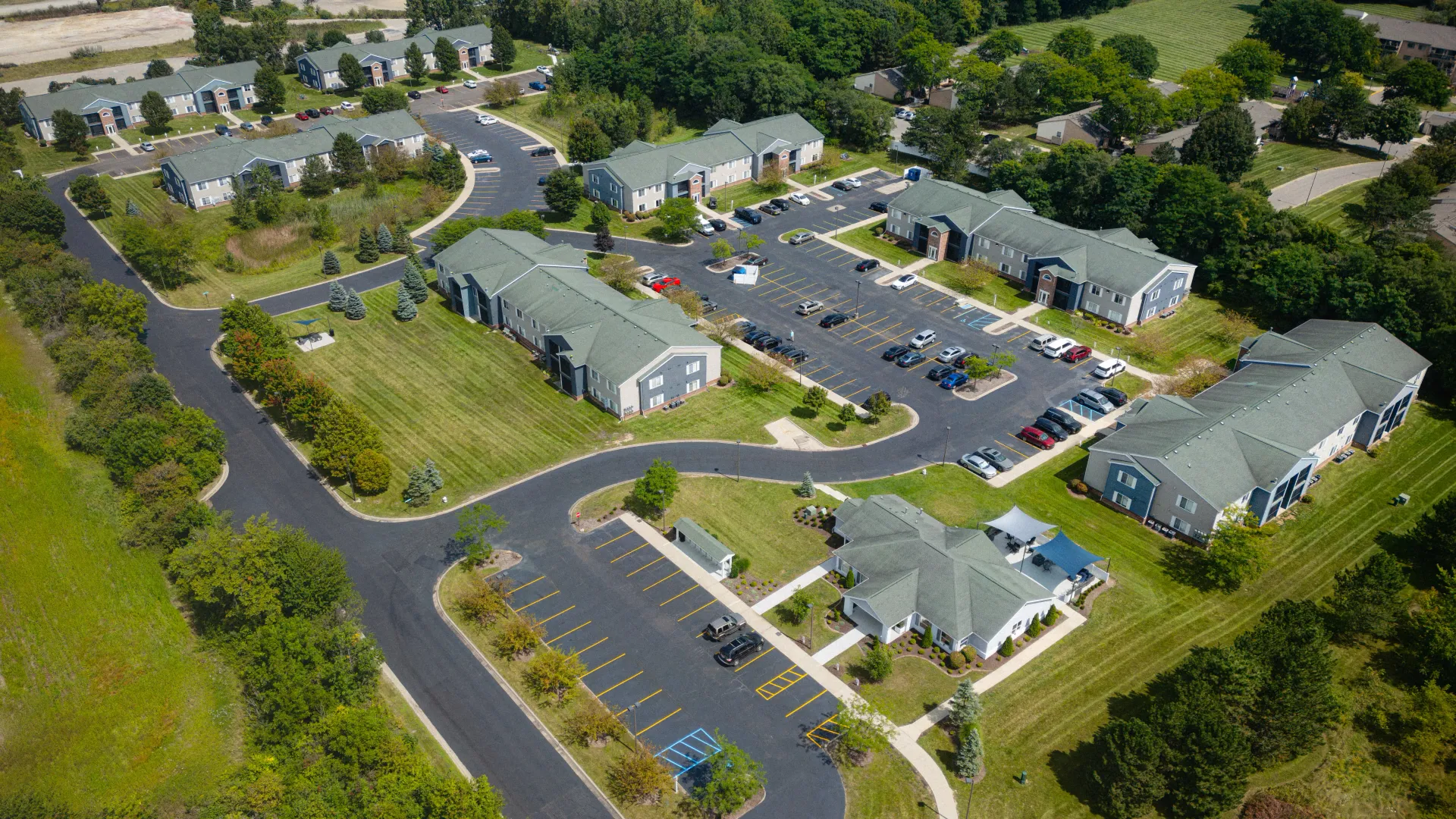 Aerial view of Atlas North community with vibrant green of the local landscape encompassing.