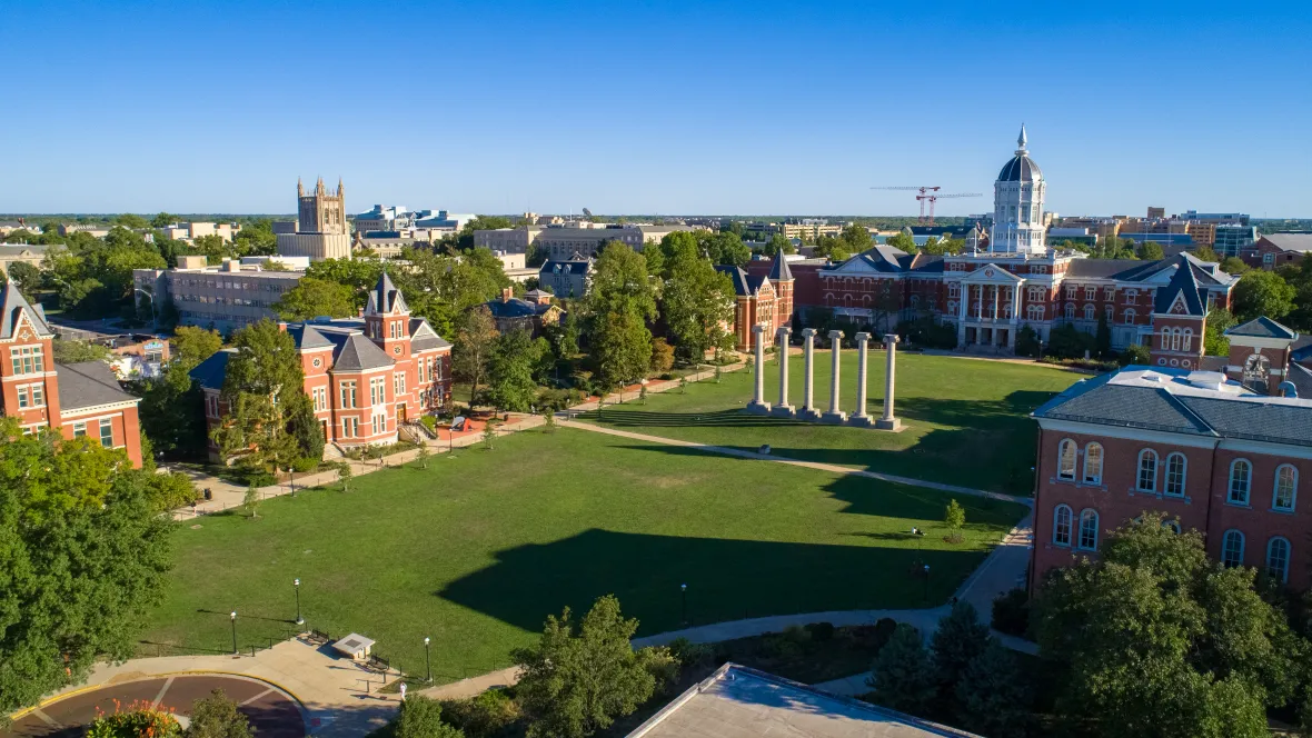 An aerial view capturing the vibrancy of Mizzou's campus with lush green surroundings and exquisite architecture.