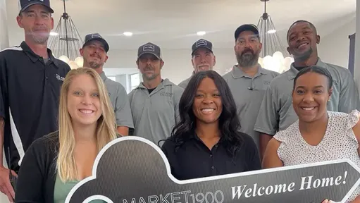 The leasing and maintenance team members at Market 1900 Apartments