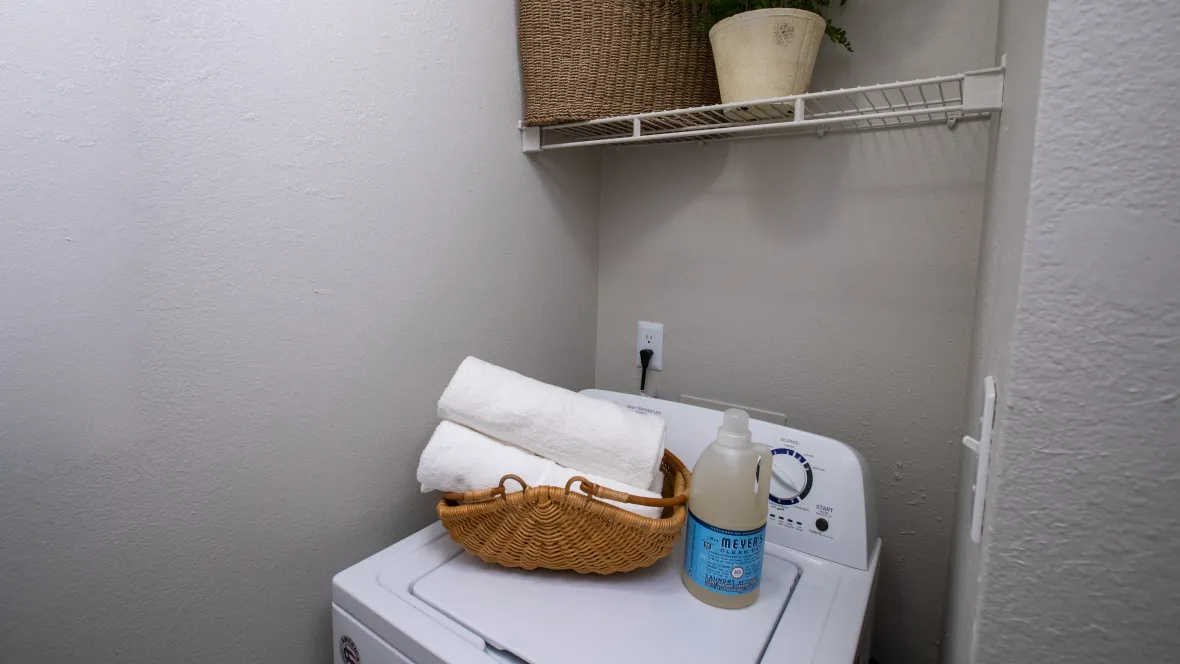 A laundry room featuring a full-size washer and dryer.