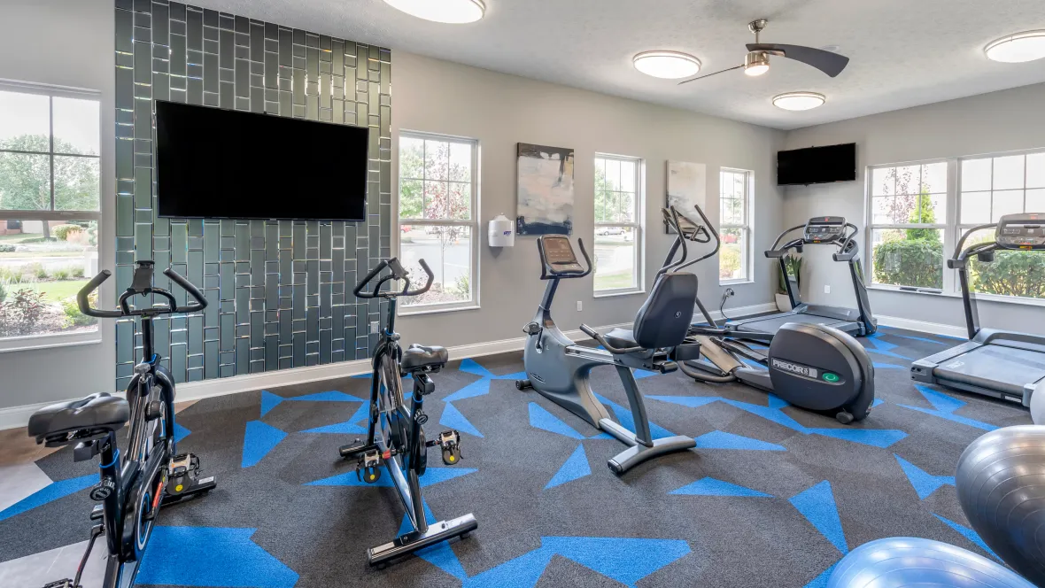 A contemporary fitness center boasting brilliant lighting and a striking design, igniting your workouts.