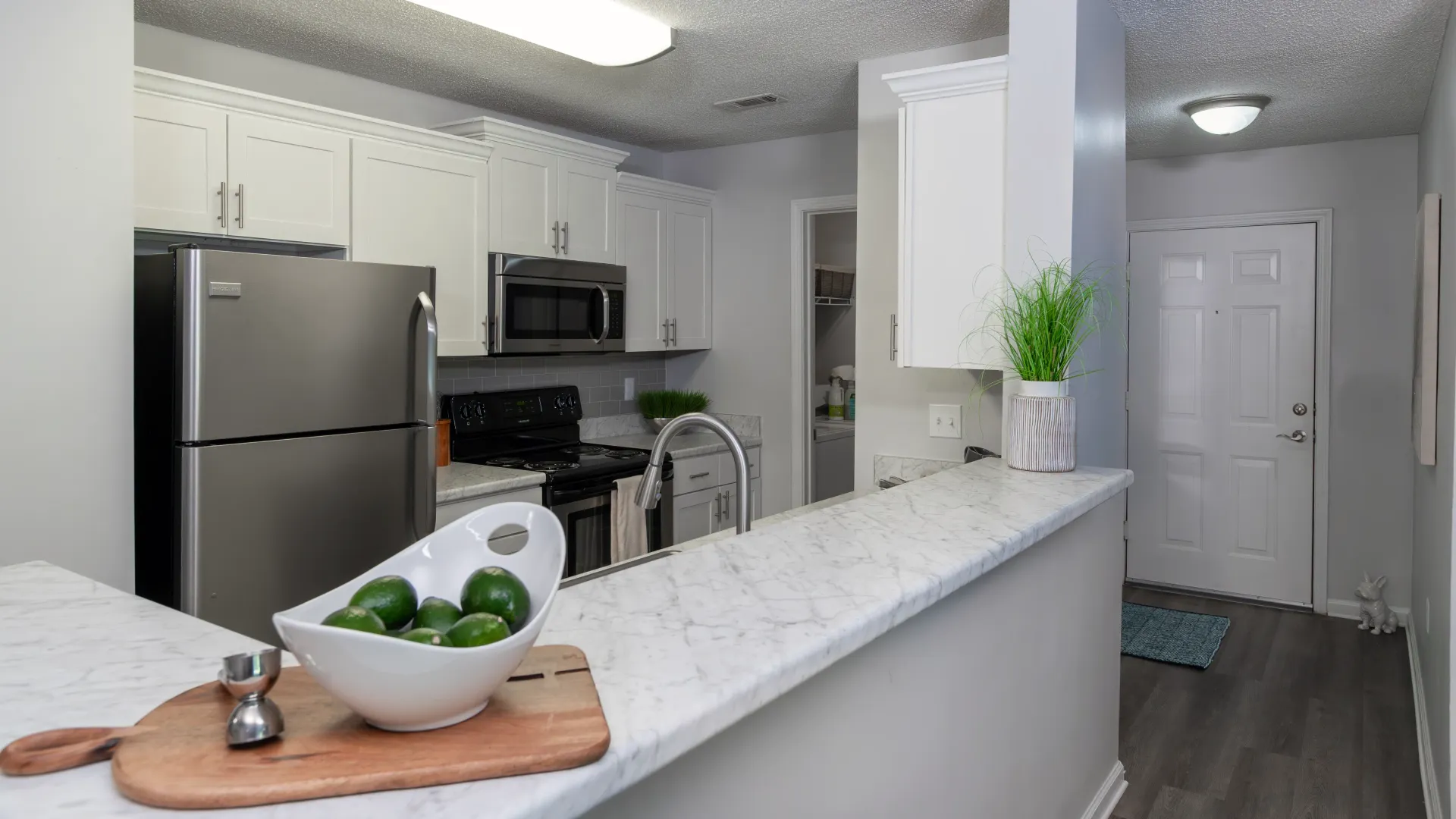 A breakfast bar separating the kitchen from the living room.