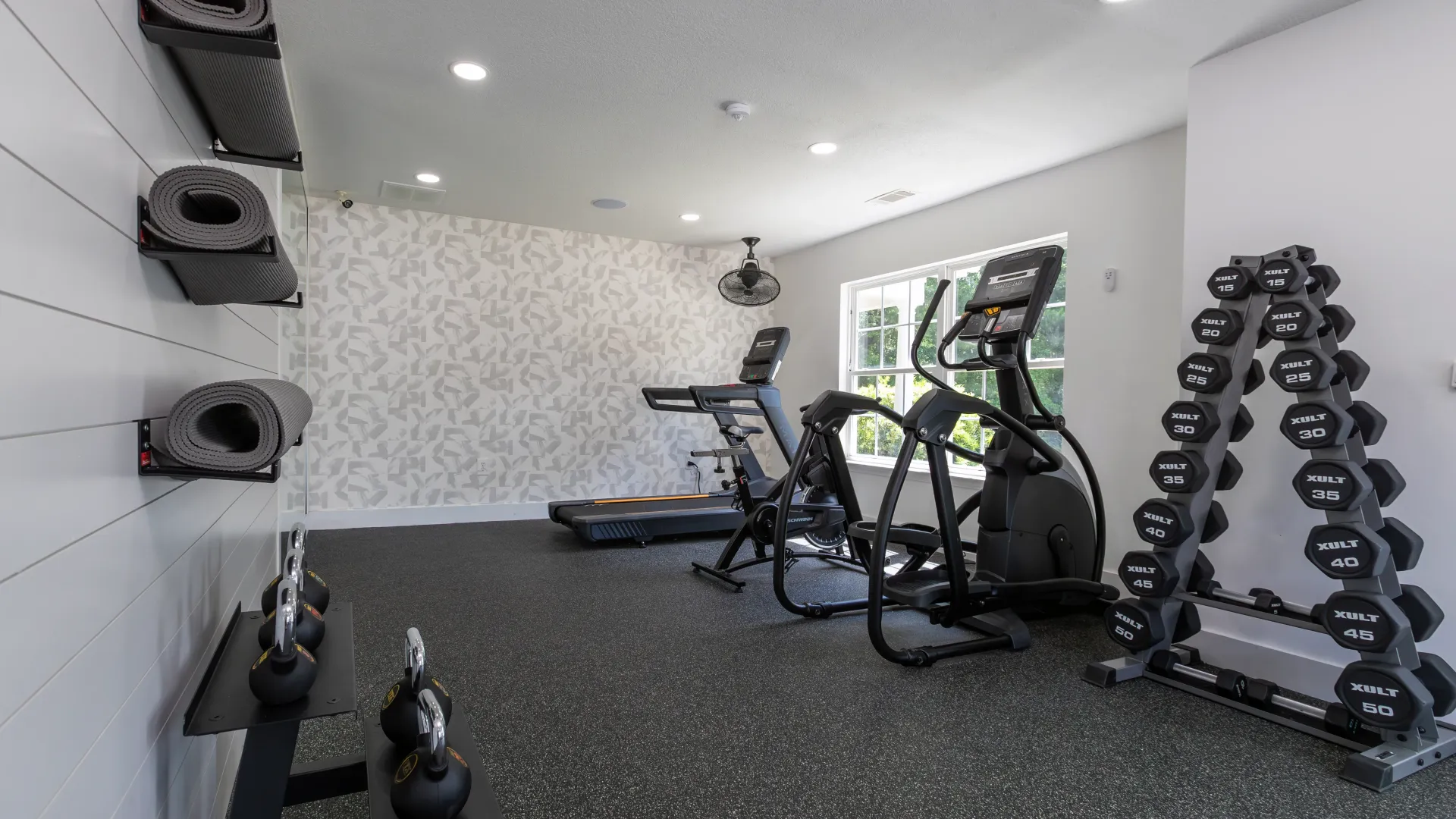 A fitness center complete with cardio equipment, free weights, yoga mats, and more.