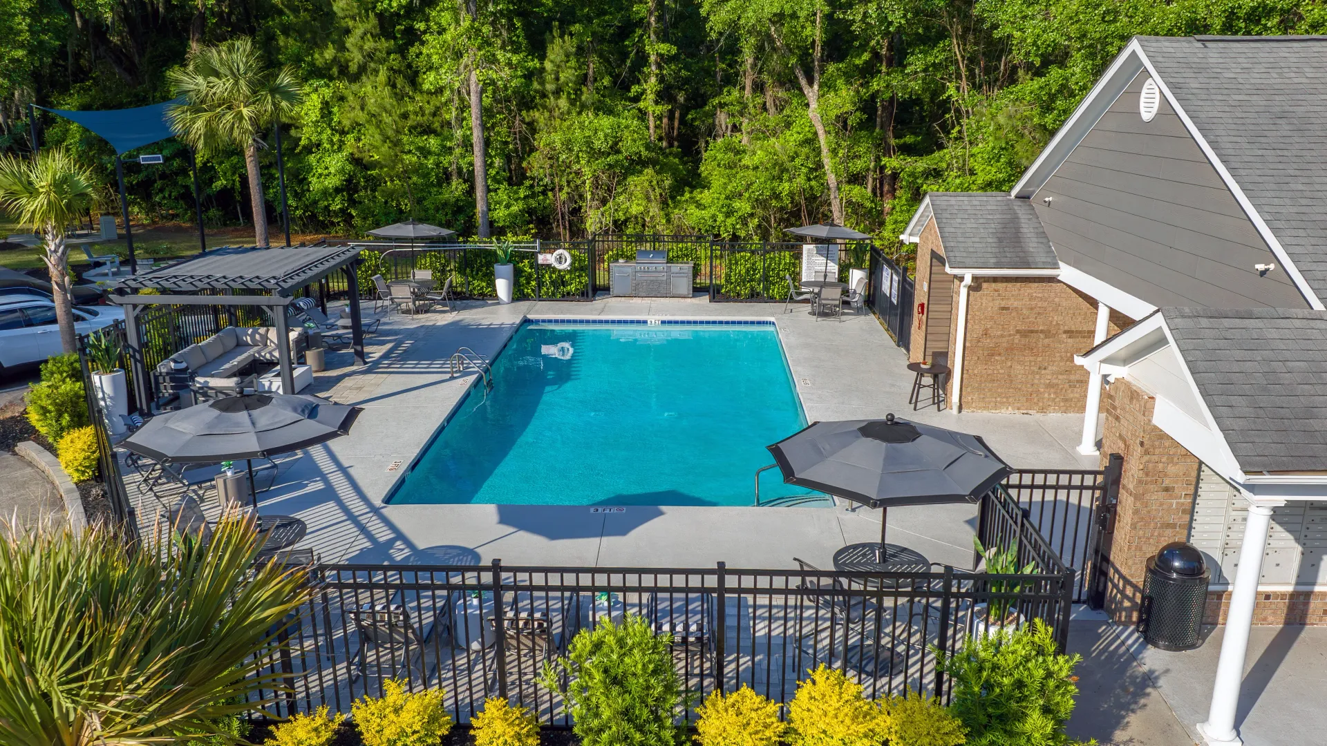 An aerial view of the pool and expansive sundeck