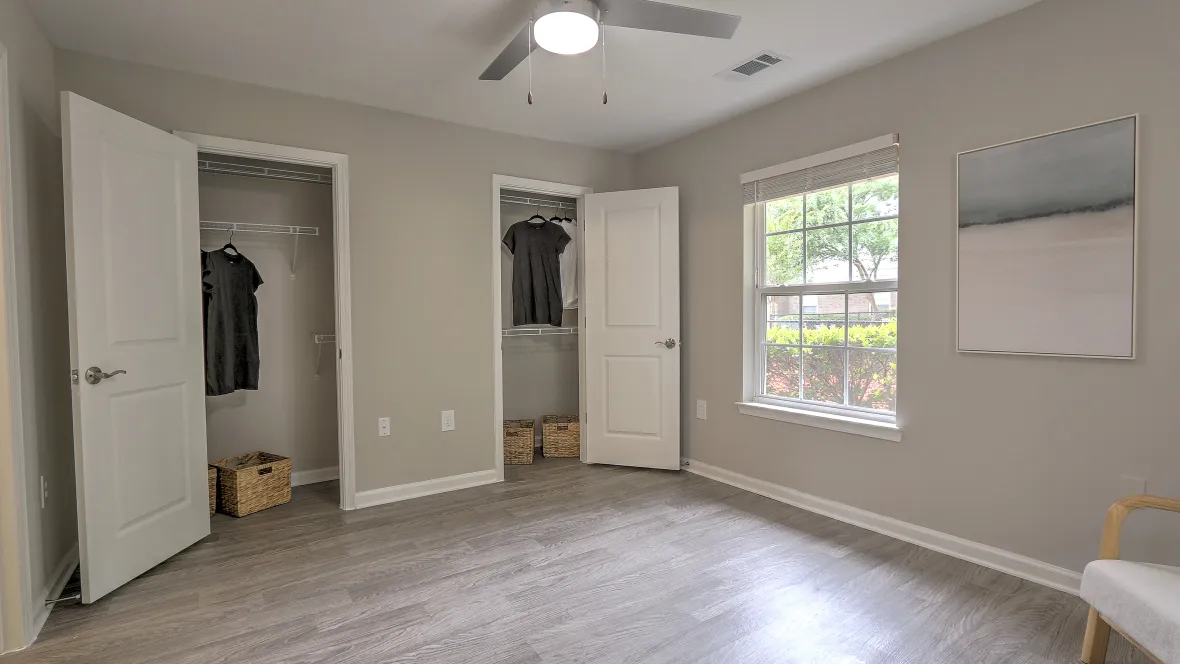 Large room with individual his and her closets for maximized storage for all.