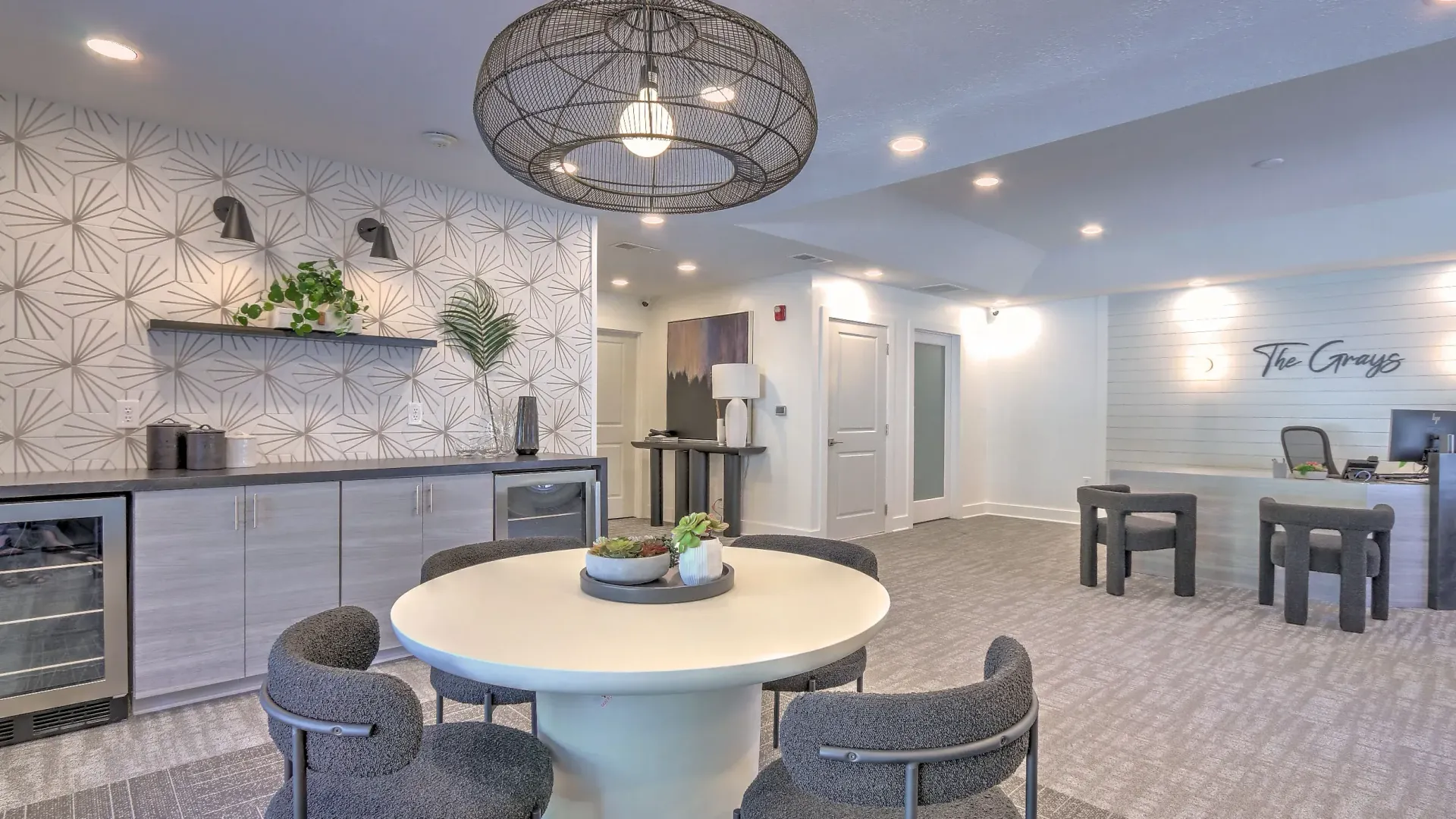 Inviting leasing center with a refreshment station and a quaint table setting perfect for chats with your property management extraordinaire.